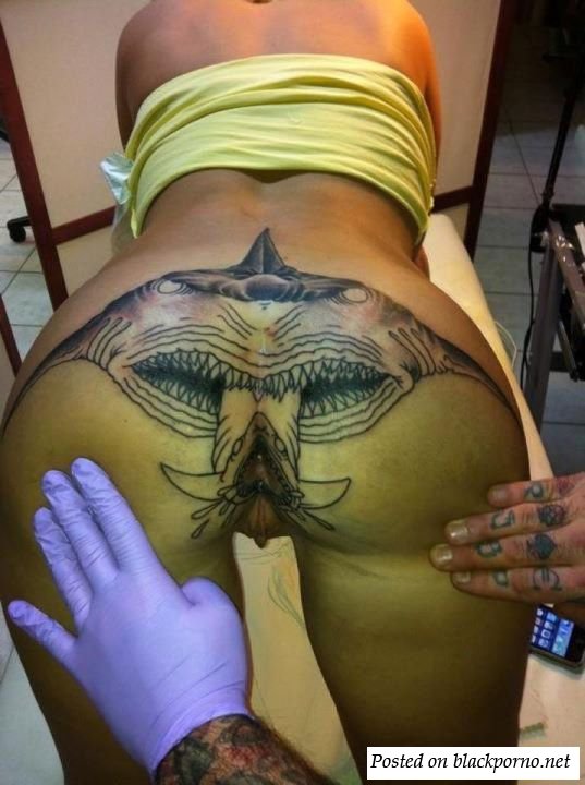 Shark ass tattoo with split tongue coming out of the ass